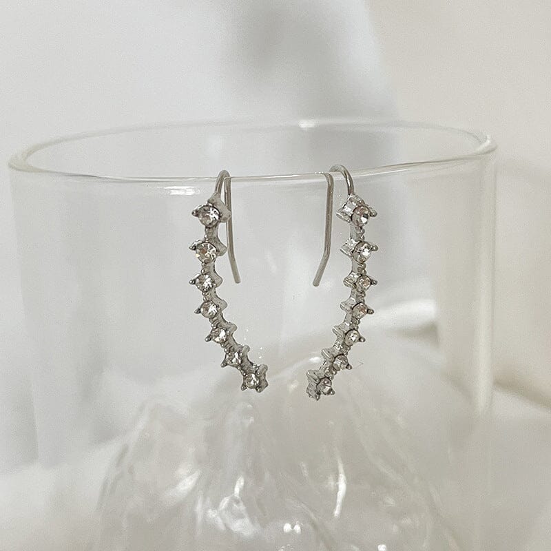 Örhänge med sju stjärnor och diamanter