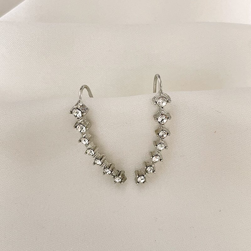 Örhänge med sju stjärnor och diamanter